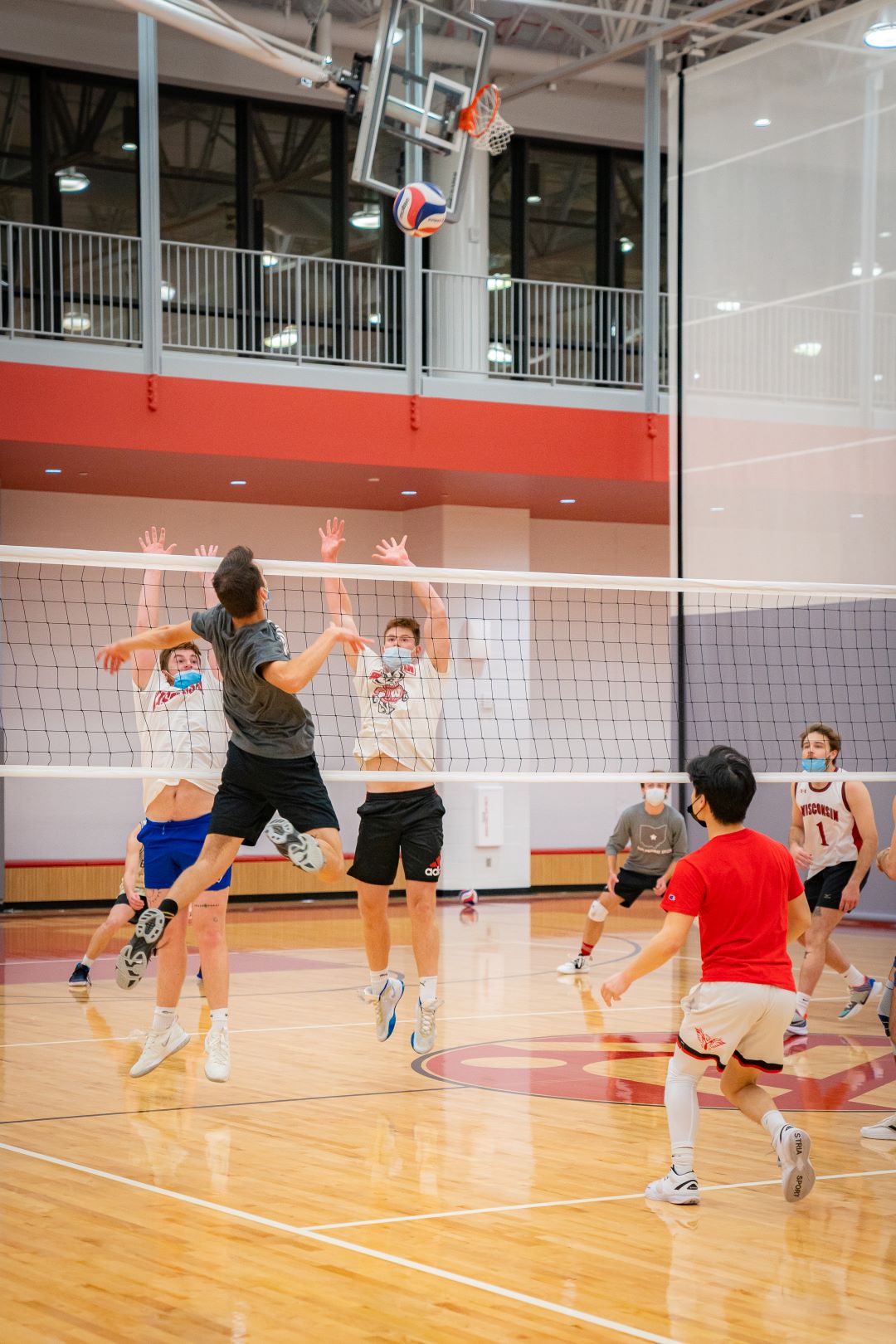 volleyball player spikes the ball